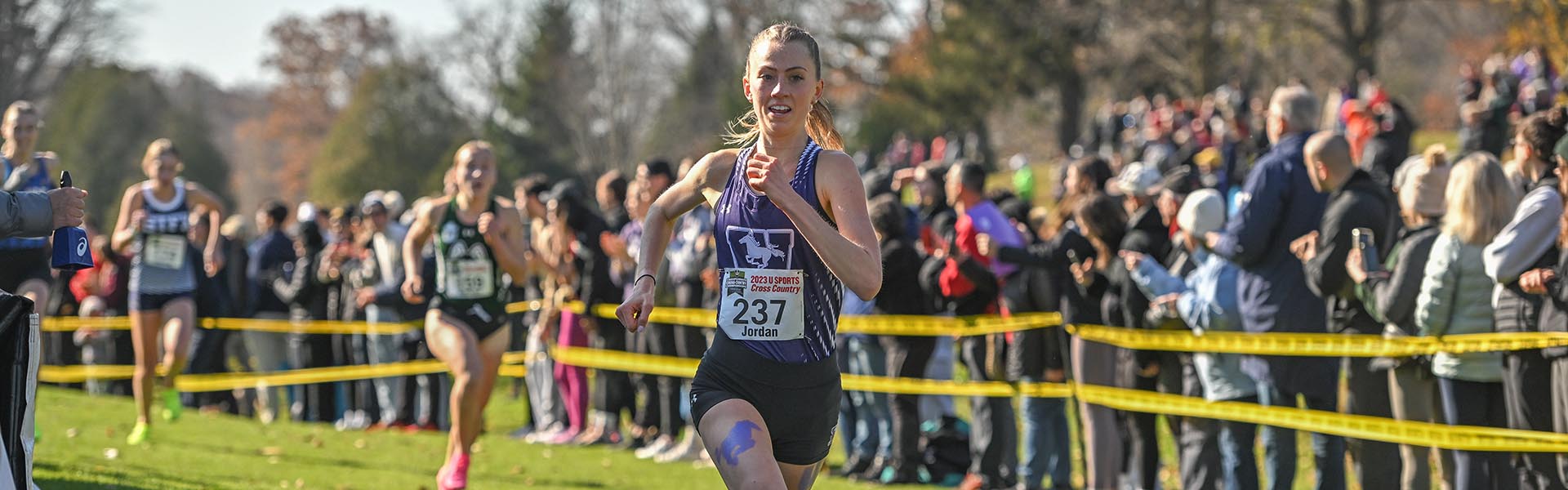 Women’s cross country runners mid-race