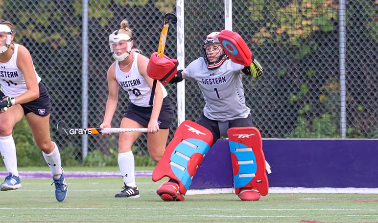 Western Mustangs field hockey goalie in net