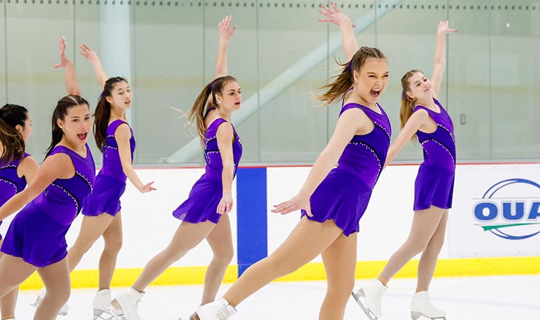 Western Mustangs men’s figure skater smiling