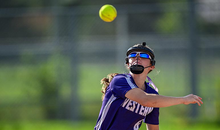 Western Mustangs softball player batting at home plate