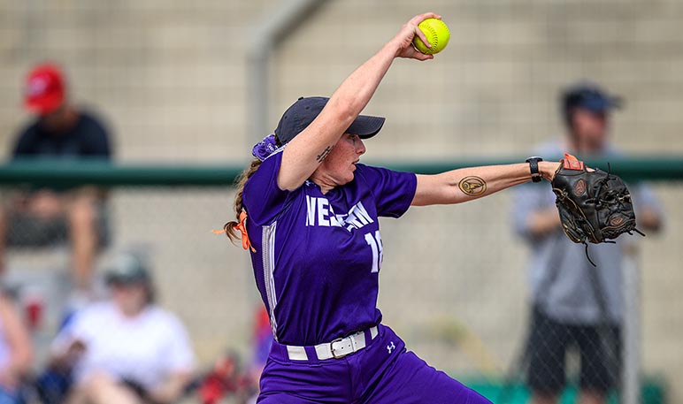 Western Mustangs softball player batting at home plate