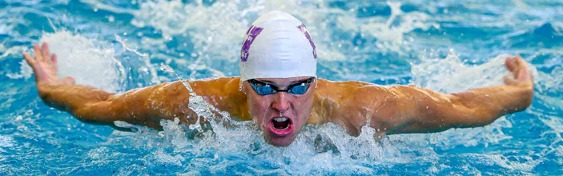 Western Mustangs female swimmer doing the butterfly stroke