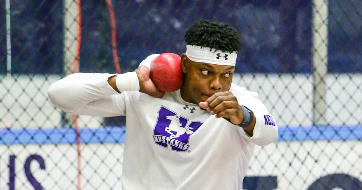 Western Mustangs male shot-putter mid-spin