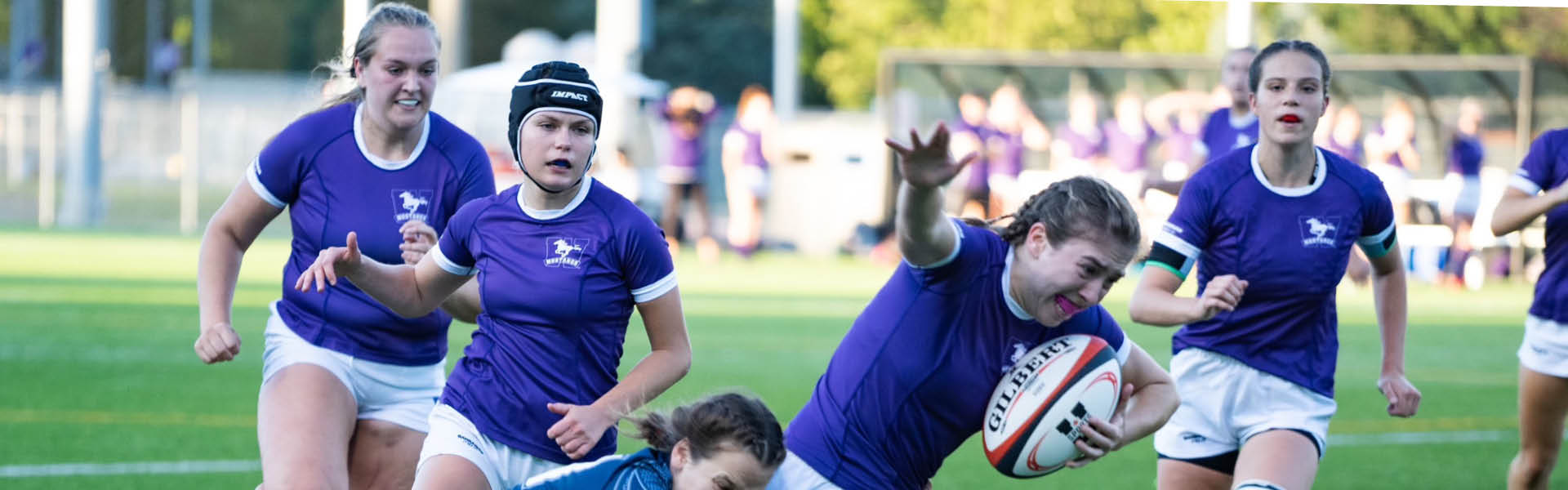 Women’s rugby game featuring the Western Mustangs