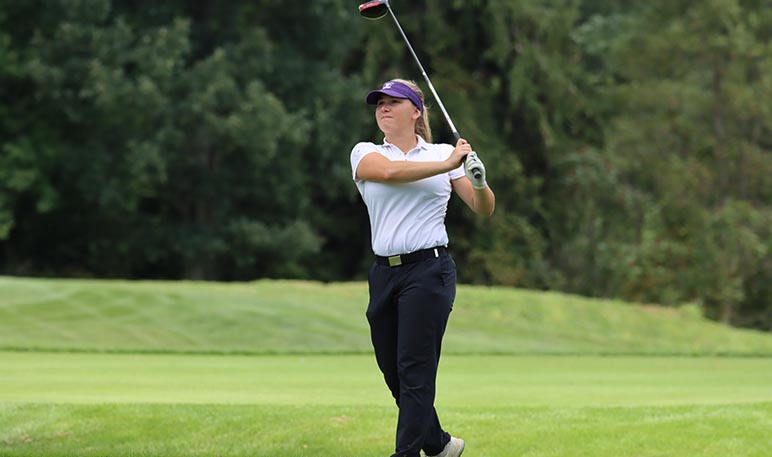 Western Mustangs women’s golfer swinging her club