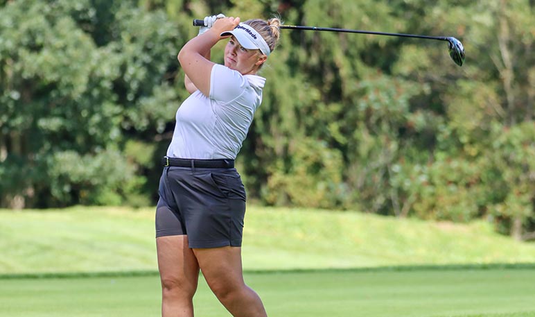 Western Mustangs women’s golfer preparing to hit the ball