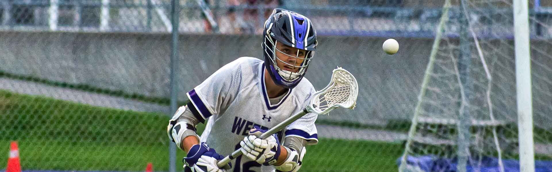 Western Mustangs men’s lacrosse player running