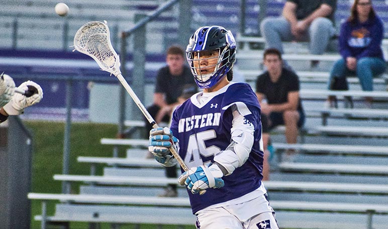 Western Mustangs men’s lacrosse player running