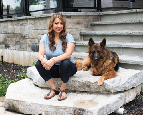 Dr. Gurjeet Rai on the steps of her Mississauga home where she lives with her husband, two sons, daughter and german shepherd, Storm. 