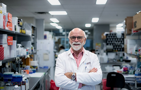 Mike Strong wears a lab coat in a lab