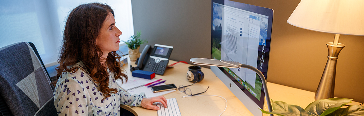 Anna Garnett working on a computer